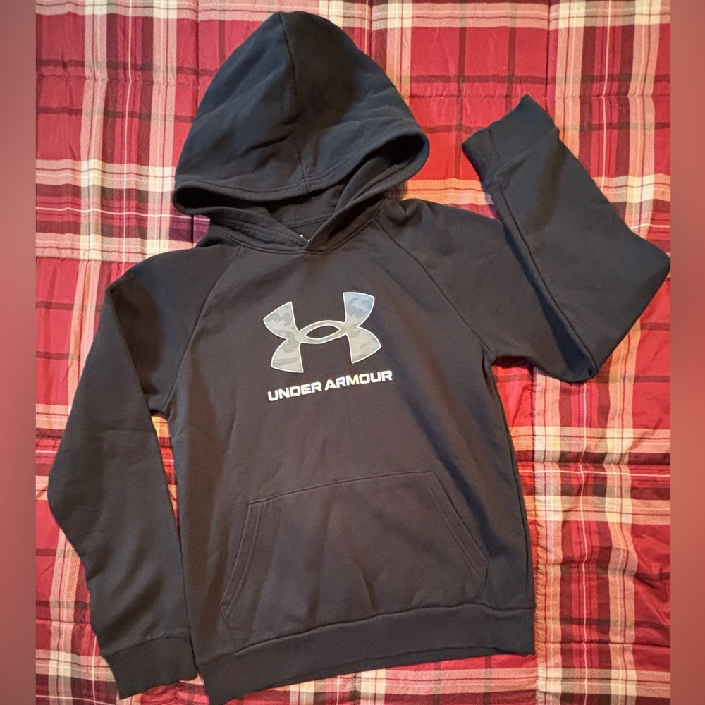 UA black fleece hoodie with gray camo logo design on front. Size YL. Like new